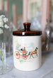 Antique jar with horse drawn carriage